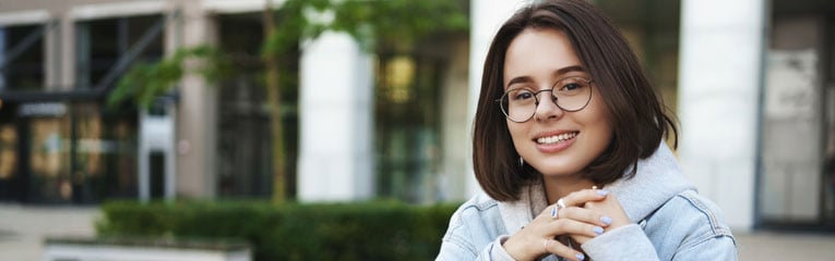 This-new-college-student-is-smiling-becuase-she-opened-a-reliable-checking-account-before-starting-school.